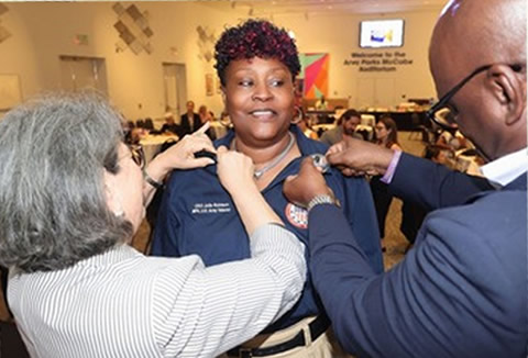 Rev. Julie Robison being honored at an event