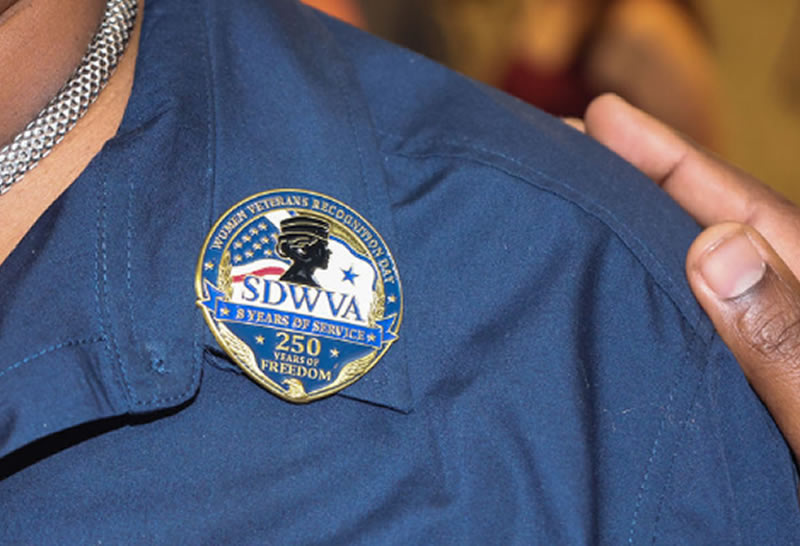 Close-up of the SDWVA commemorative pin marking 8 years of service and 250 years of freedom