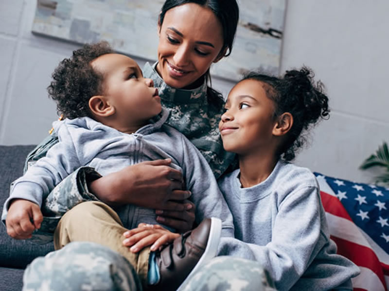 Woman veteran with her children